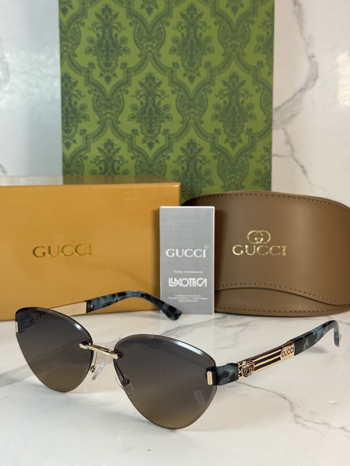 Lentes GUCCI — Ref. LF-L221-0006 con el packaging mostrado en la fotografía