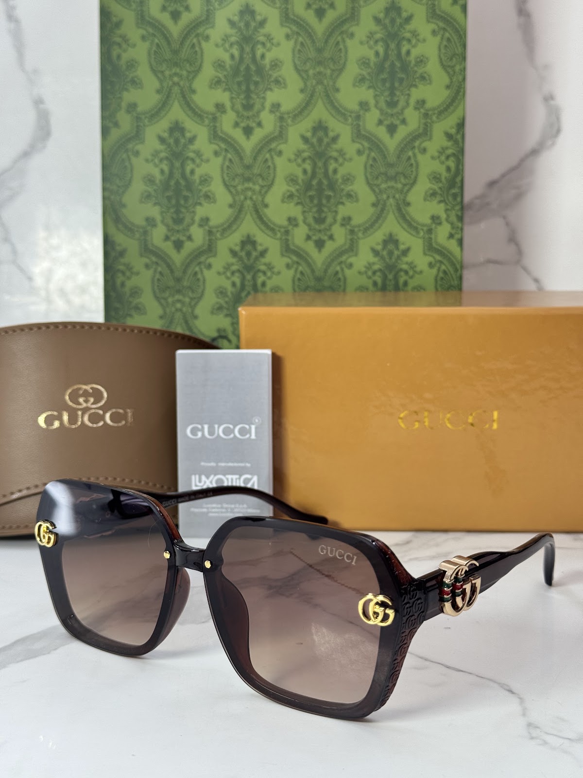 Lentes GUCCI — Ref. LF-L221-0020 con el packaging mostrado en la fotografía