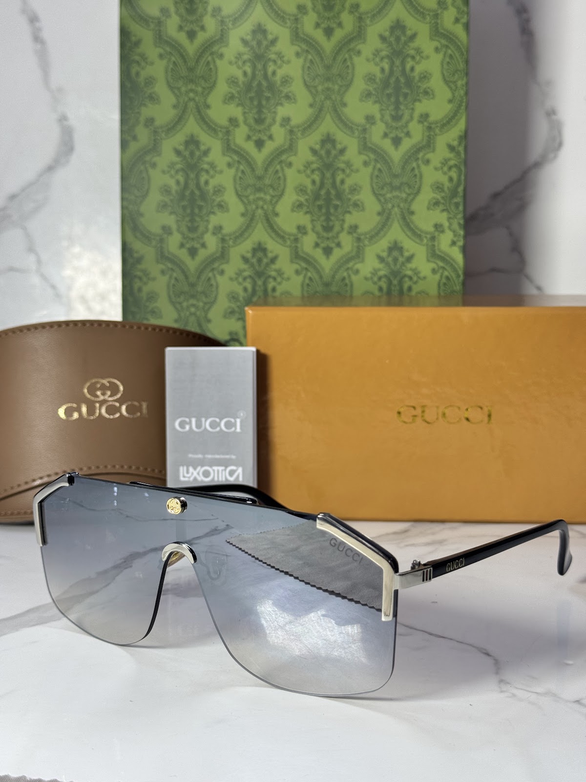 Lentes GUCCI — Ref. LF-L221-0023 con el packaging mostrado en la fotografía