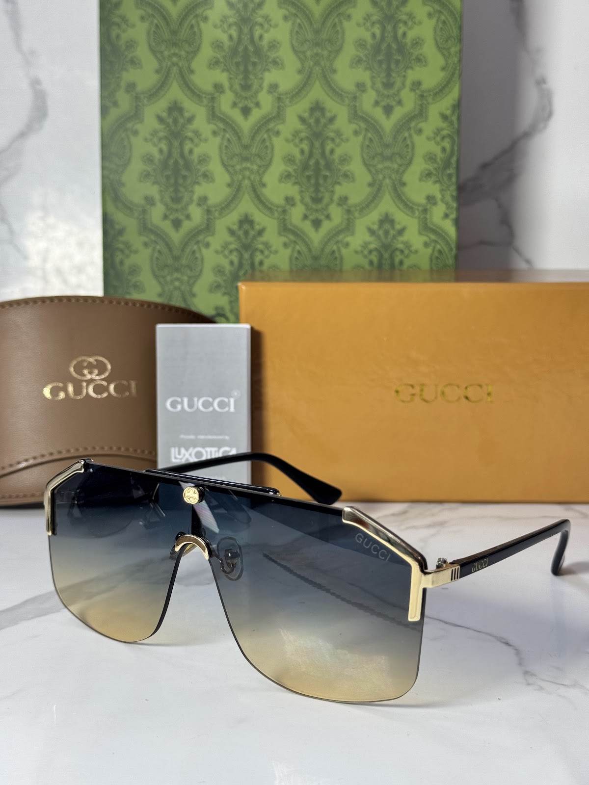 Lentes GUCCI — Ref. LF-L221-0026 con el packaging mostrado en la fotografía