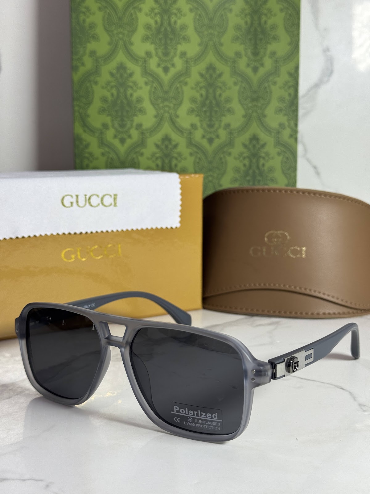 Lentes GUCCI — Ref. LF-L221-0050 con el packaging mostrado en la fotografía