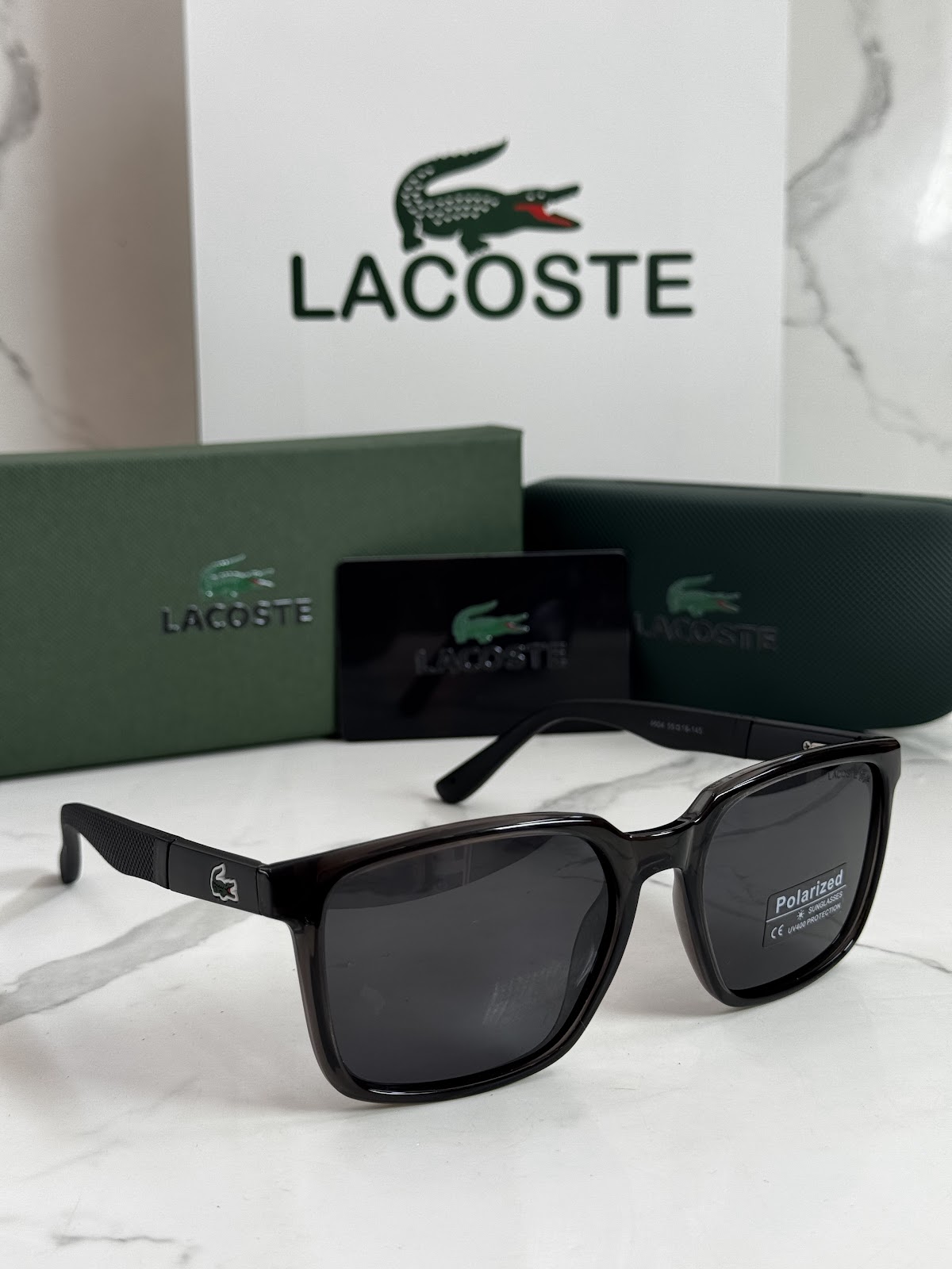 Lentes LACOSTE — Ref. LF-L233-0016 con el packaging mostrado en la fotografía