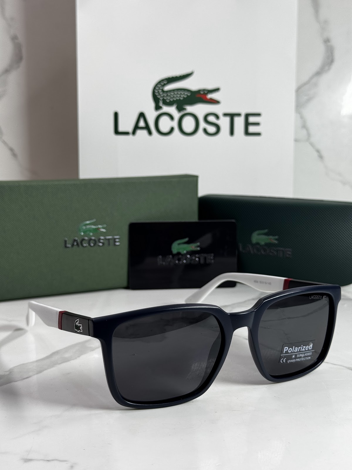Lentes LACOSTE — Ref. LF-L233-0021 con el packaging mostrado en la fotografía