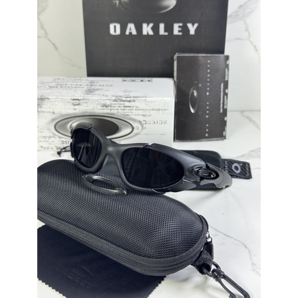 Lentes OAKLEY — Ref. LF-L235-0039 con el packaging mostrado en la fotografía