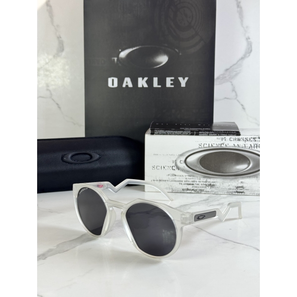 Lentes OAKLEY — Ref. LF-L235-0059 con el packaging mostrado en la fotografía