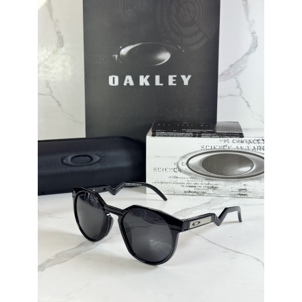Lentes OAKLEY — Ref. LF-L235-0061 con el packaging mostrado en la fotografía