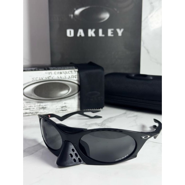 Lentes OAKLEY — Ref. LF-L235-0235 con el packaging mostrado en la fotografía