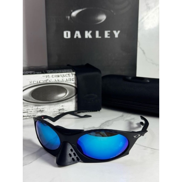 Lentes OAKLEY — Ref. LF-L235-0237 con el packaging mostrado en la fotografía