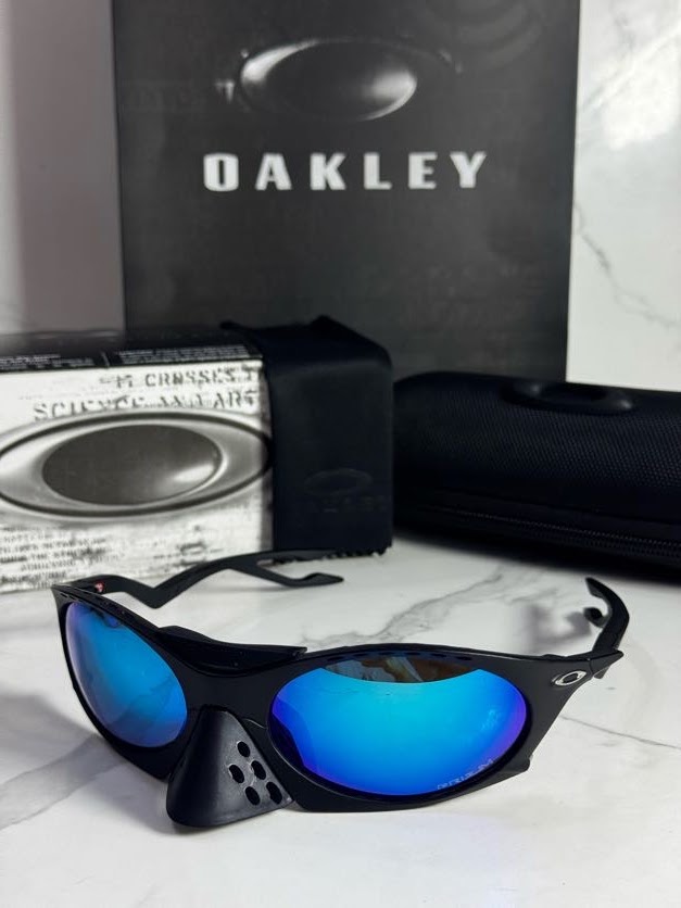 Lentes OAKLEY — Ref. LF-L235-0237 con el packaging mostrado en la fotografía