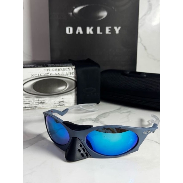 Lentes OAKLEY — Ref. LF-L235-0239 con el packaging mostrado en la fotografía
