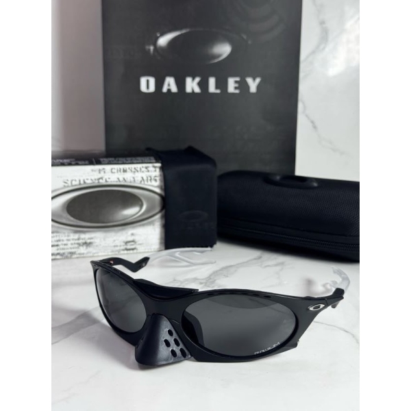 Lentes OAKLEY — Ref. LF-L235-0240 con el packaging mostrado en la fotografía
