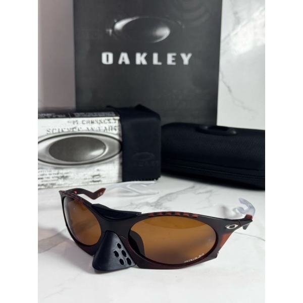 Lentes OAKLEY — Ref. LF-L235-0241 con el packaging mostrado en la fotografía
