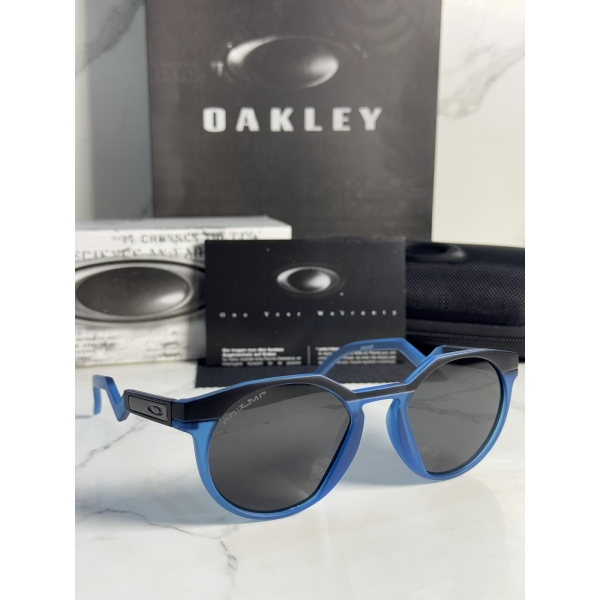 Lentes OAKLEY — Ref. LF-L235-0257 con el packaging mostrado en la fotografía