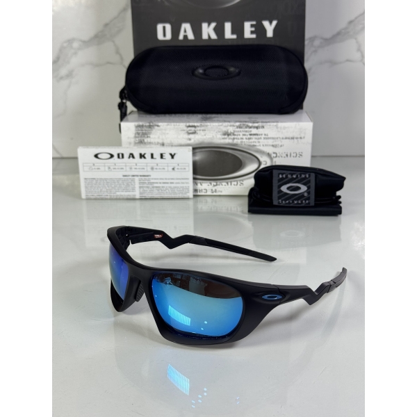 Lentes OAKLEY — Ref. LF-L235-0332 con el packaging mostrado en la fotografía