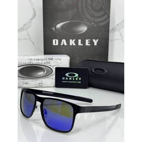 Lentes OAKLEY — Ref. LF-L235-0345 con el packaging mostrado en la fotografía