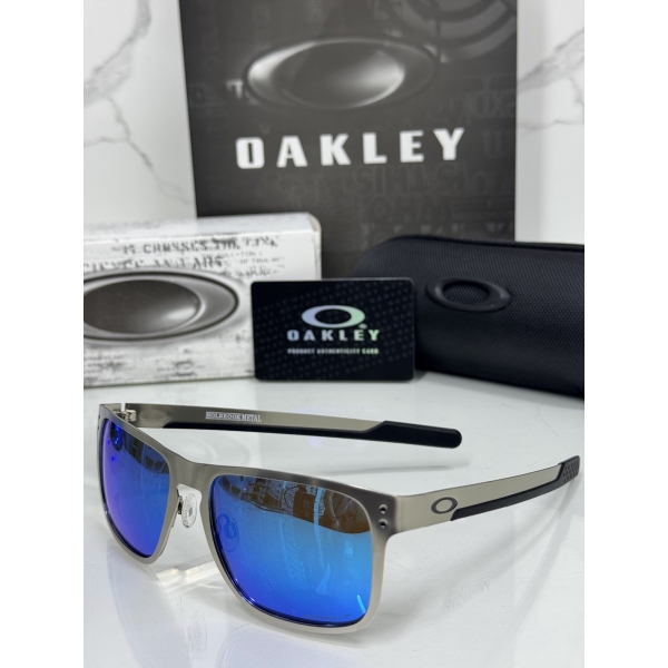 Lentes OAKLEY — Ref. LF-L235-0347 con el packaging mostrado en la fotografía