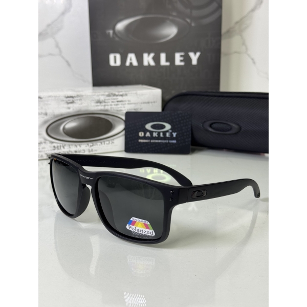 Lentes OAKLEY — Ref. LF-L235-0353 con el packaging mostrado en la fotografía