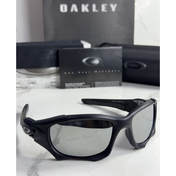 Lentes OAKLEY — Ref. LF-L235-0433 con el packaging mostrado en la fotografía