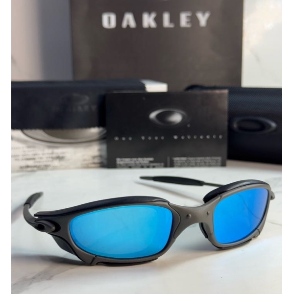 Lentes OAKLEY — Ref. LF-L235-0440 con el packaging mostrado en la fotografía