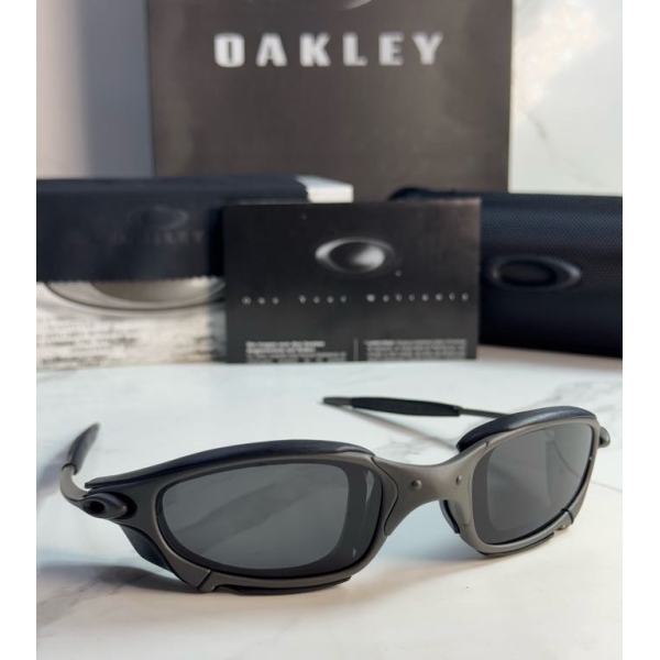 Lentes OAKLEY — Ref. LF-L235-0443 con el packaging mostrado en la fotografía