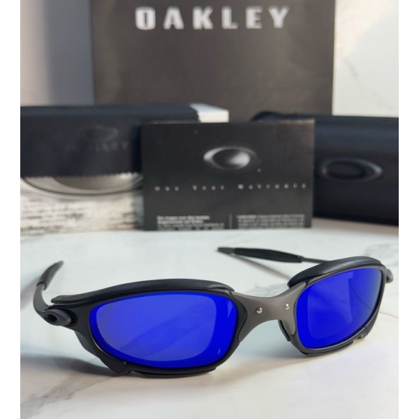 Lentes OAKLEY — Ref. LF-L235-0446 con el packaging mostrado en la fotografía
