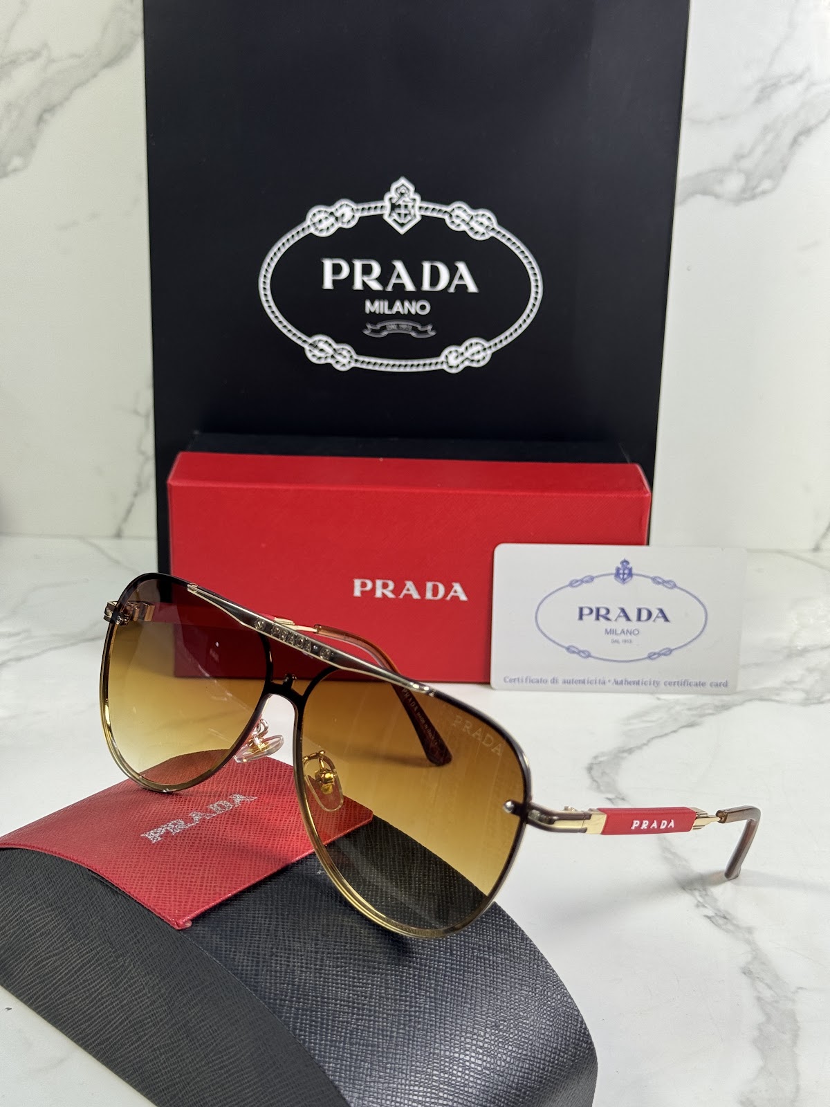 Lentes PRADA — Ref. LF-L227-0010 con el packaging mostrado en la fotografía