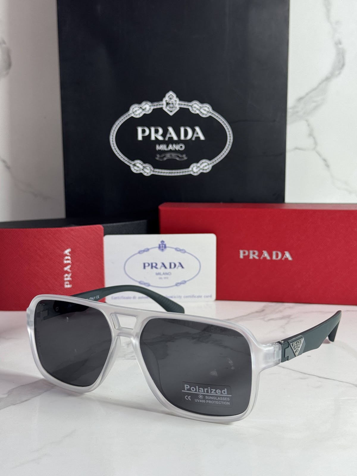 Lentes PRADA — Ref. LF-L227-0101 con el packaging mostrado en la fotografía
