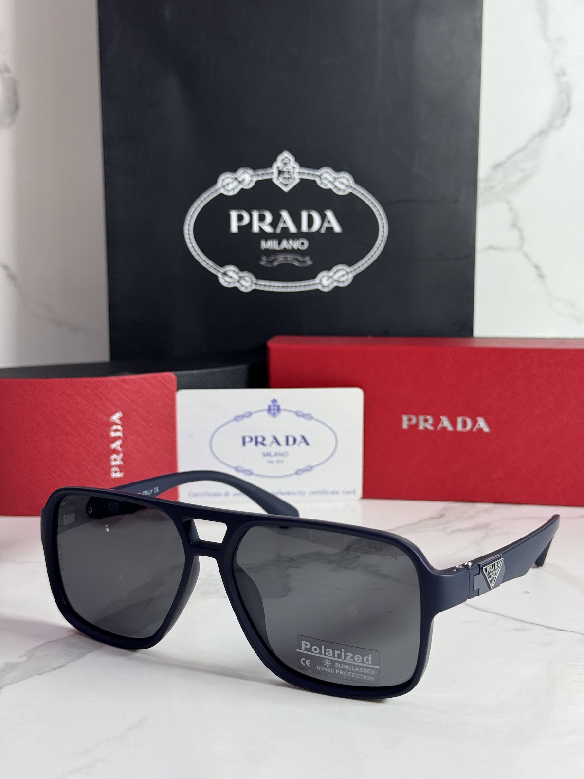 Lentes PRADA — Ref. LF-L227-0102 con el packaging mostrado en la fotografía