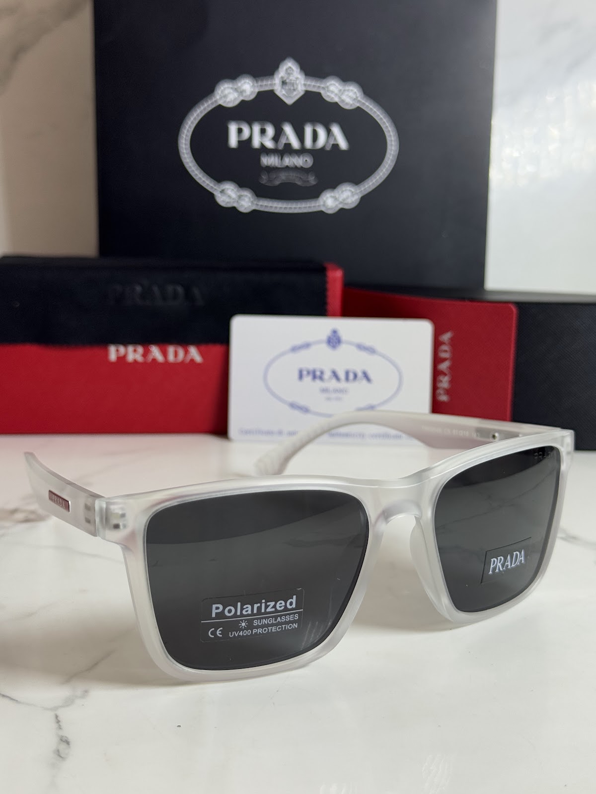 Lentes PRADA — Ref. LF-L227-0115 con el packaging mostrado en la fotografía