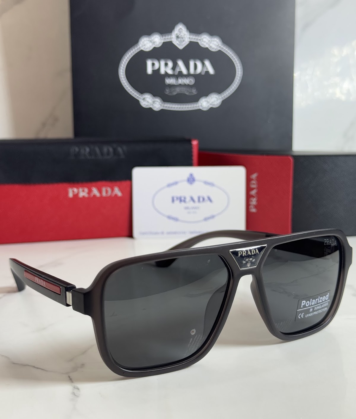 Lentes PRADA — Ref. LF-L227-0120 con el packaging mostrado en la fotografía
